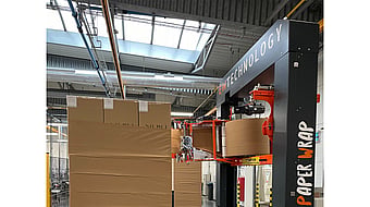 a paper wrapping machine being used at a Mondi factory